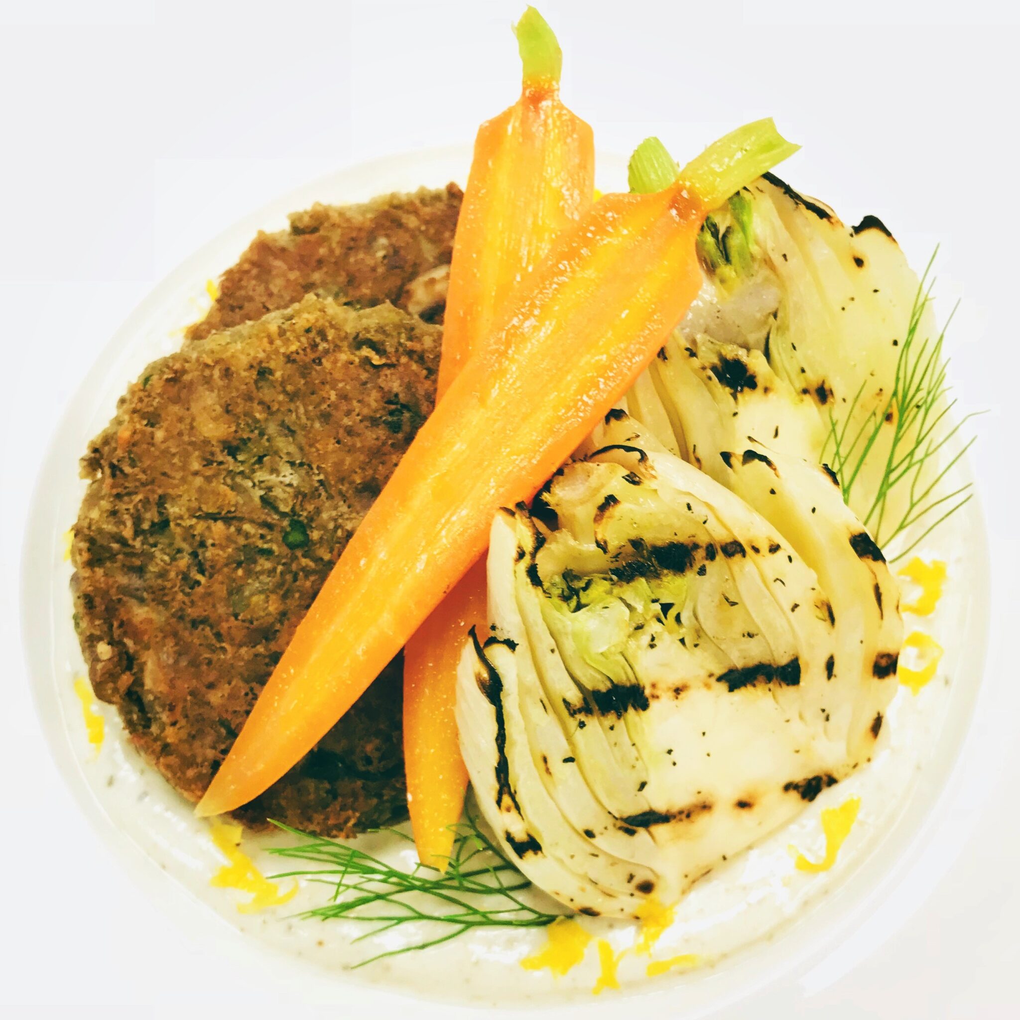 Plant Based Lentil Cakes with Lemon Cumin Yogurt, Charred Fennel, and Roasted Carrots